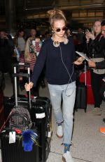 CARA DELEVINGNE at LAX Airport in Los Angeles 04/08/2016