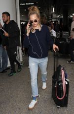 CARA DELEVINGNE at LAX Airport in Los Angeles 04/08/2016