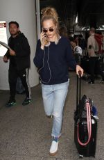 CARA DELEVINGNE at LAX Airport in Los Angeles 04/08/2016