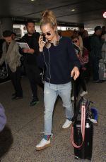 CARA DELEVINGNE at LAX Airport in Los Angeles 04/08/2016