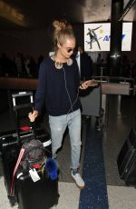 CARA DELEVINGNE at LAX Airport in Los Angeles 04/08/2016