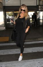 CHARLOTTE MCKINNEY Arrives at LAX Airport in Los Angeles 04/14/2016