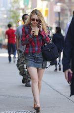 DAKOTA FANNING in Denim Skirt Out in New York 04/21/2016