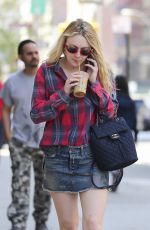 DAKOTA FANNING in Denim Skirt Out in New York 04/21/2016