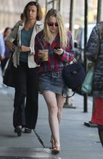 DAKOTA FANNING in Denim Skirt Out in New York 04/21/2016