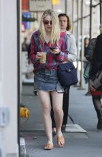 DAKOTA FANNING in Denim Skirt Out in New York 04/21/2016