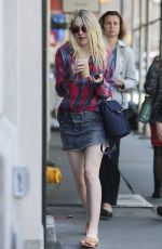 DAKOTA FANNING in Denim Skirt Out in New York 04/21/2016