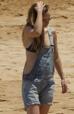 OLIVIA WILDE in Bikini Top at a Beach in Hawaii 04/17/2016