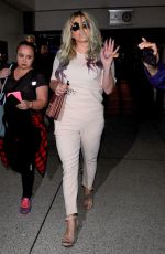 KESHA SEBERT Arrives at LAX Airport in Los Angeles 04/15/2016