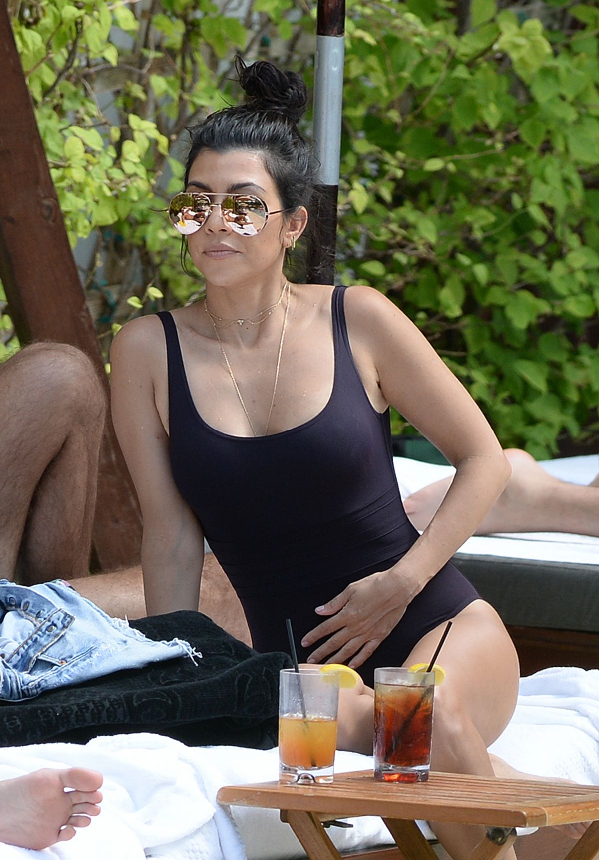 KOURTNEY KARDASHIAN in Swimsuit at a Pool in Miami Beach 04/23/2016 KOURTNEY KARDASHIAN in Swimsuit at a Pool in Miami Beach 04/23/2016
