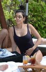KOURTNEY KARDASHIAN in Swimsuit at a Pool in Miami Beach 04/23/2016