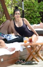 KOURTNEY KARDASHIAN in Swimsuit at a Pool in Miami Beach 04/23/2016