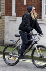 MADONNA Riding a Bike Out in London 04/18/2016