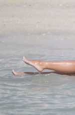 TULISA CONTOSTAVLOS in Pink Bikini at a Beach in Dubai 04/05/2016