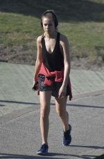 BRIDGET MALCOM Out Walking on Bondi Beach 05/24/2016