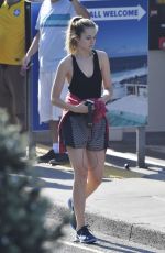 BRIDGET MALCOM Out Walking on Bondi Beach 05/24/2016