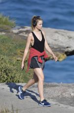 BRIDGET MALCOM Out Walking on Bondi Beach 05/24/2016