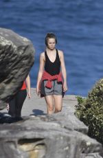 BRIDGET MALCOM Out Walking on Bondi Beach 05/24/2016