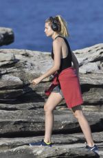 BRIDGET MALCOM Out Walking on Bondi Beach 05/24/2016