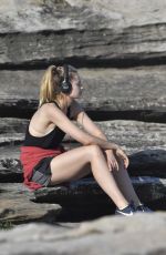 BRIDGET MALCOM Out Walking on Bondi Beach 05/24/2016