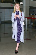 ELLE FANNING at LAX Airport in Los Angeles 05/29/2016