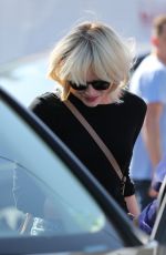 EMMA STONE in Ripped Jeans Out in Beverly Hills 05/21/2016