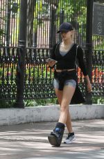 HAILEY BALDWIN in Denim Shorts nad Foot Brace Out in New York 05/12/2016