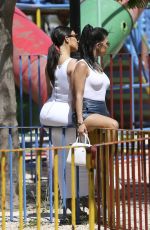 KIM and KOURTNEY KARDASHIAN at a Park in Havana 05/05/2016
