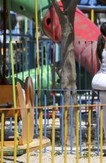KIM and KOURTNEY KARDASHIAN at a Park in Havana 05/05/2016