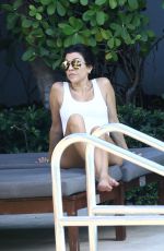 KOURTNEY KARDASHIAN in Swimsuit at a Pool in Miami 05/02/2016