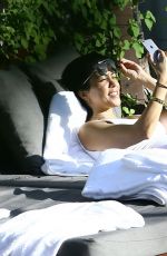 KOURTNEY KARDASHIAN in Swimsuit at a Pool in Miami 05/02/2016