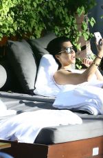 KOURTNEY KARDASHIAN in Swimsuit at a Pool in Miami 05/02/2016