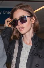 LILY COLLINS at LAX Airport in Los Angeles 04/30/2016