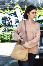 LILY COLLINS Heading to Mao