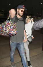 MILEY CYRUS and Liam Hemsworth at LAX Airport in Los Angeles 05/02/2016