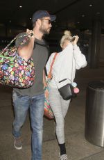 MILEY CYRUS and Liam Hemsworth at LAX Airport in Los Angeles 05/02/2016