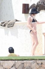 MILLA JOVOVICH in Bikini at a Pool 05/26/2016