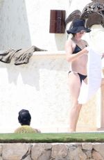 MILLA JOVOVICH in Bikini at a Pool 05/26/2016