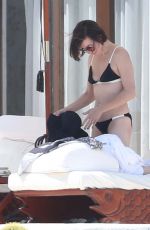 MILLA JOVOVICH in Bikini at a Pool 05/26/2016