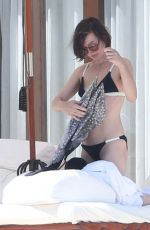 MILLA JOVOVICH in Bikini at a Pool 05/26/2016