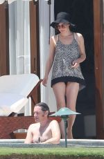 MILLA JOVOVICH in Bikini at a Pool 05/26/2016