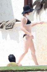 MILLA JOVOVICH in Bikini at a Pool 05/26/2016