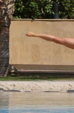 OLA JORDAN in Bikini Doing Yoga at a Pool 04/26/2016