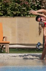 OLA JORDAN in Bikini Doing Yoga at a Pool 04/26/2016