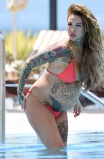 Pregnant SALLIE AXL in Bikini at a Pool in Tenerife 05/11/2016