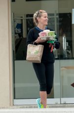 REESE WITHERSPOON Carrying a Handful of Drinks Out in Los Angeles 05/29/2016