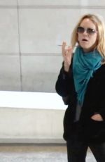 VANESSA PARADIS Smokes a Cigarette at LAX Airport in Los Angeles 05/25/2016