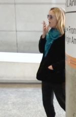 VANESSA PARADIS Smokes a Cigarette at LAX Airport in Los Angeles 05/25/2016