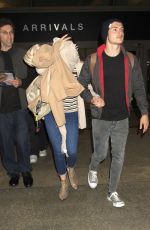 BELLA THORNE and Gregg Sulkin at Los Angeles Internatipnal Airport 06/03/2016