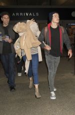 BELLA THORNE and Gregg Sulkin at Los Angeles Internatipnal Airport 06/03/2016